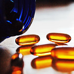 A bottle with capsules spilling out