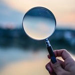 Selective focus photo of a magnifying glass